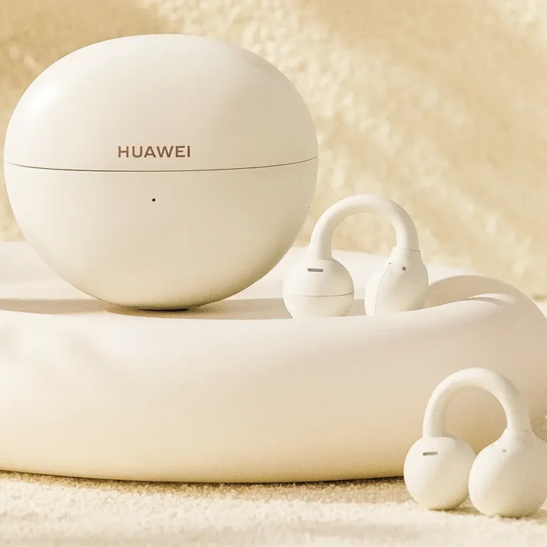 Huawei FreeClip 2 wireless earbuds with charging case in Feather White color on a minimal beige background, showcasing the C-bridge open-ear design.